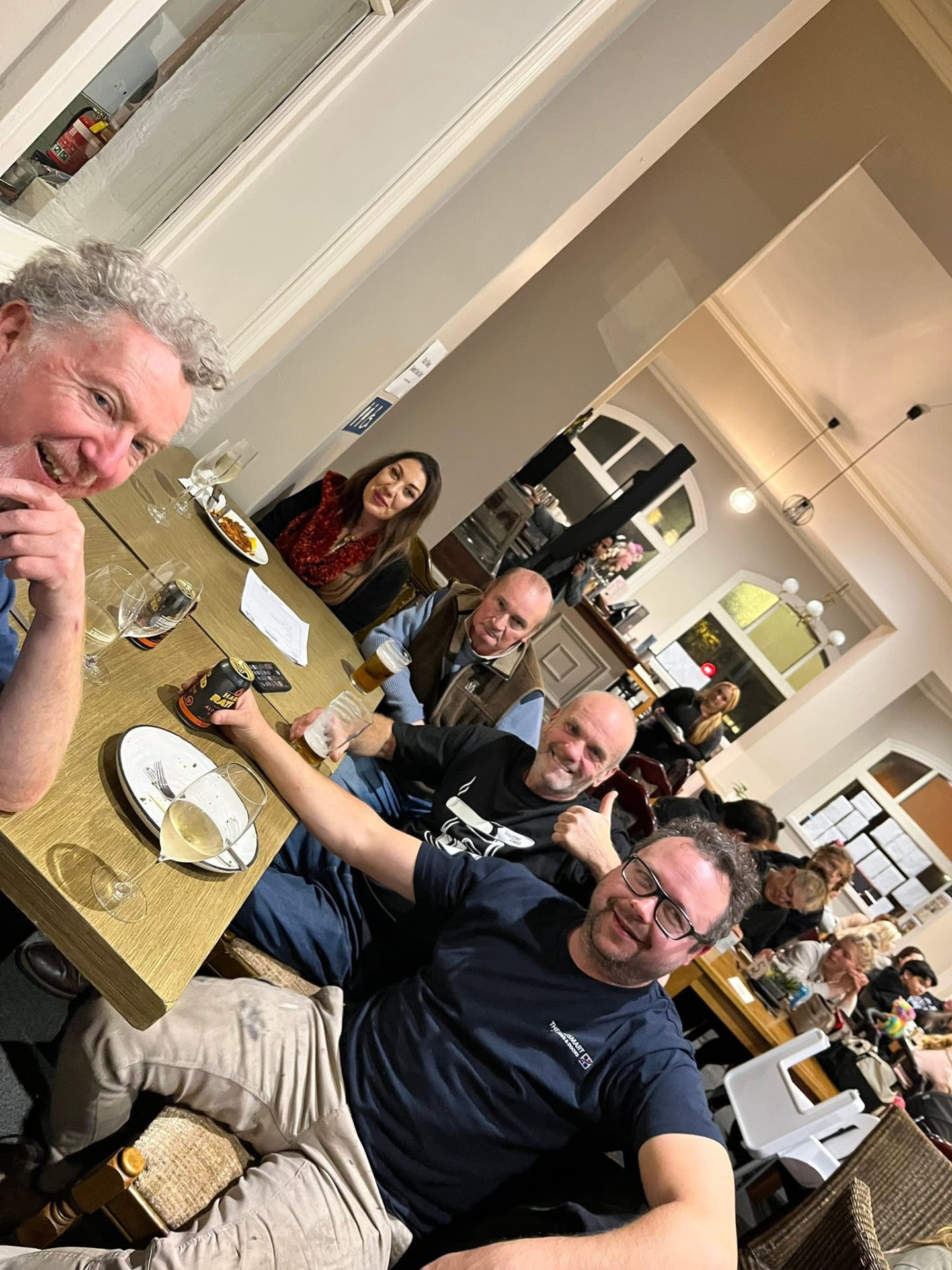 Locals raising a glass together at the pub