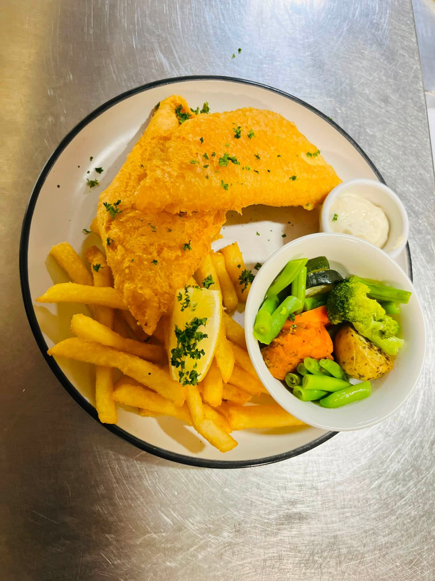 Golden battered fish and chips with lemon and tartare