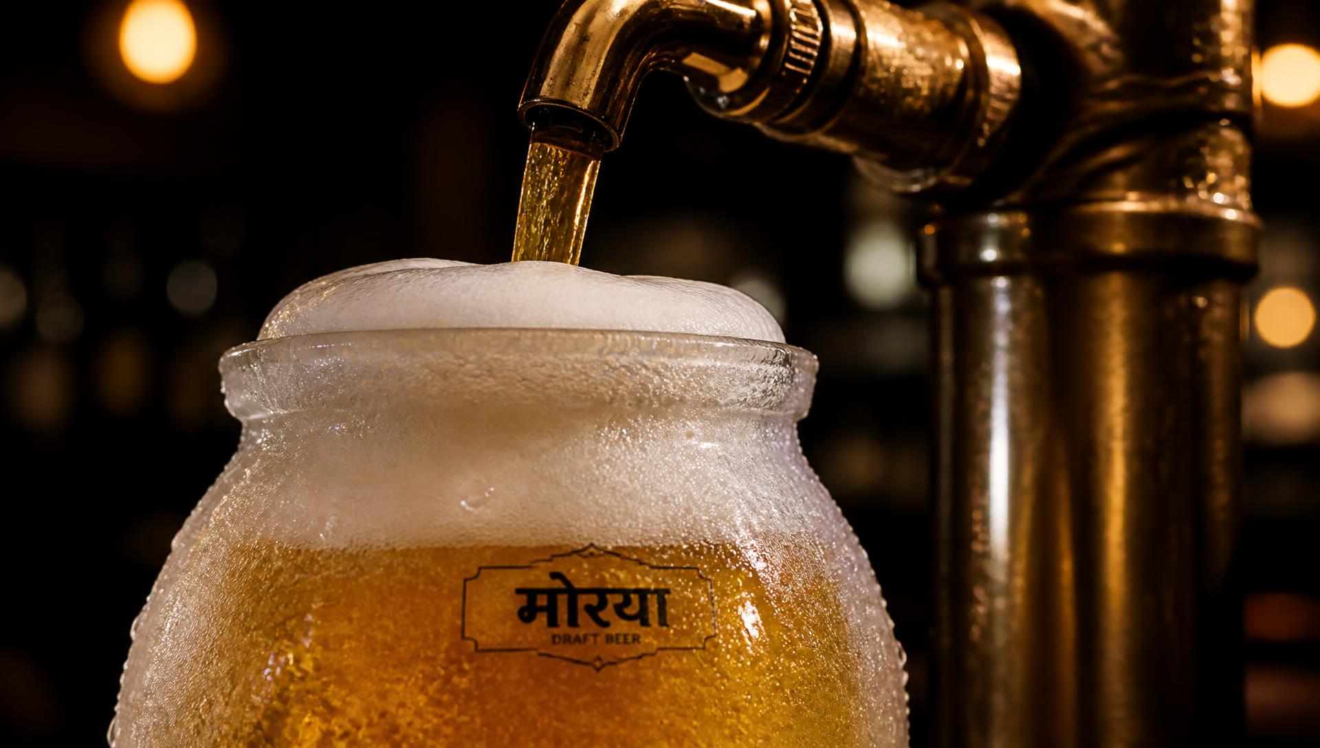 Draught beer poured into a frosted glass